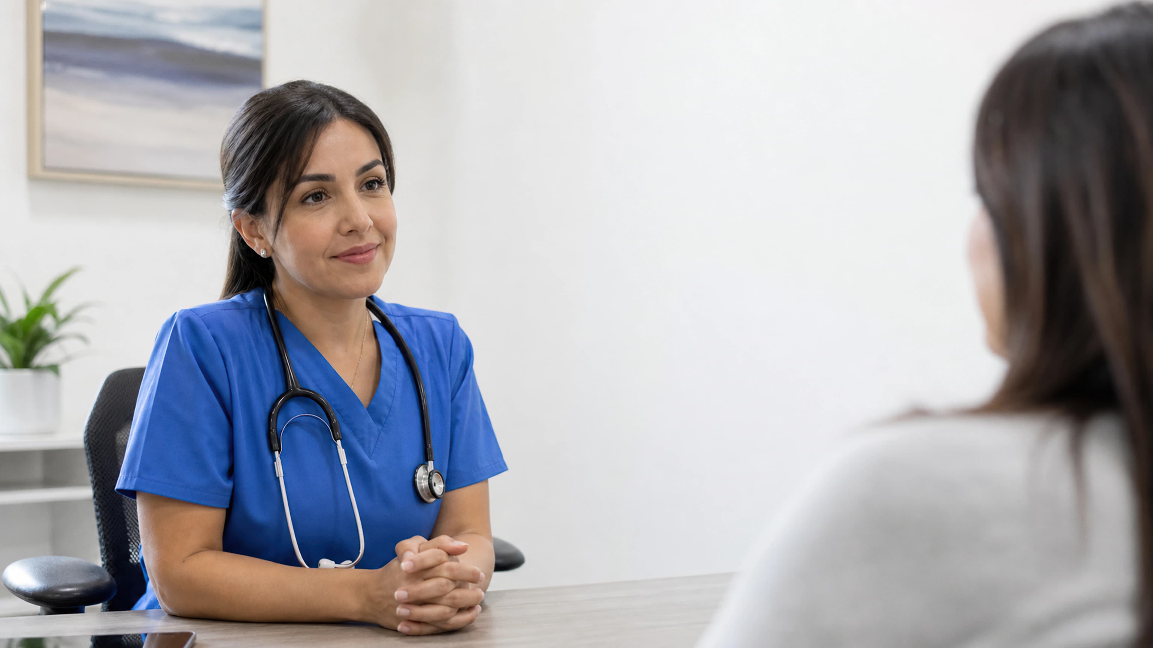 An NHS dietitian in a consultation with a patient