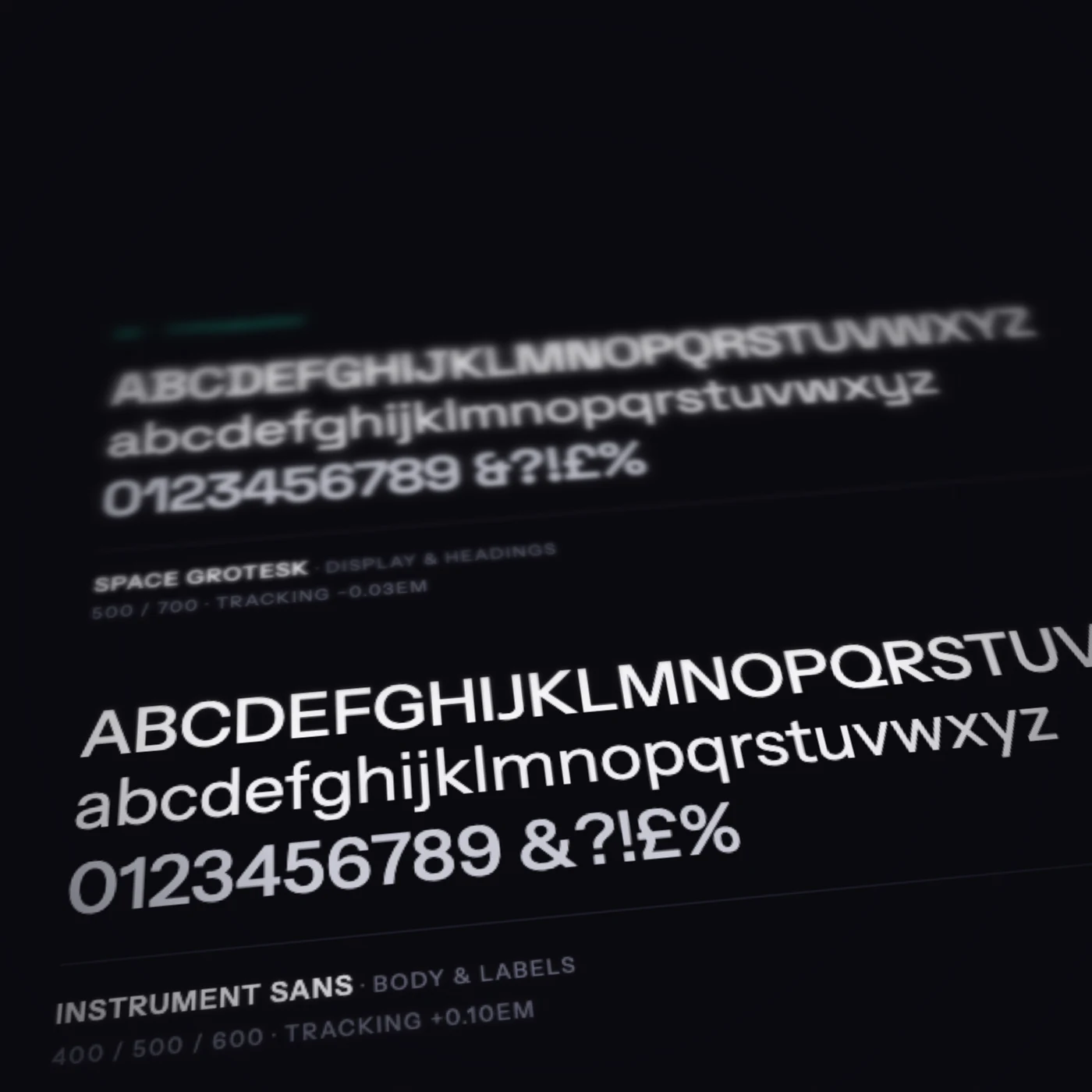 A Snowbridge type specimen seen at a tilt: the alphabet and figures in Space Grotesk, then in Instrument Sans, each with its name, weights and tracking beneath; the near rows sharp, the far rows soft